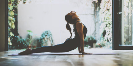 woman in workout gear stretching