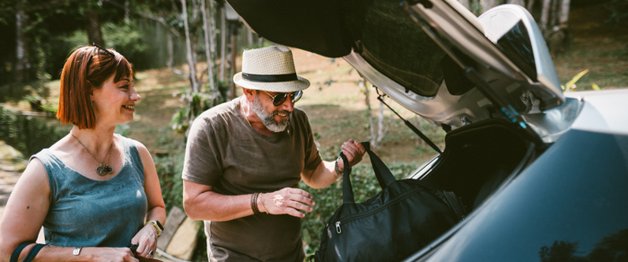 50 Year Old Couple Packing Car for Holiday