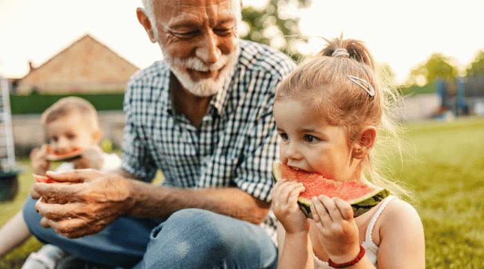 Grandfather and grand daughters spending time together